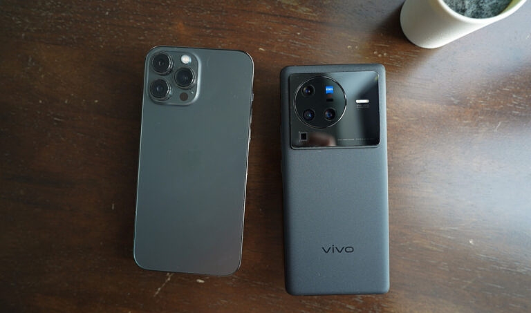 Vivo X80 Pro and iPhone 13 Pro on a table
